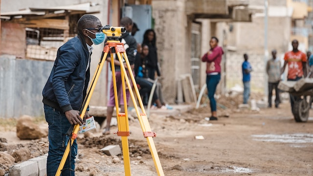 man surveying construction site